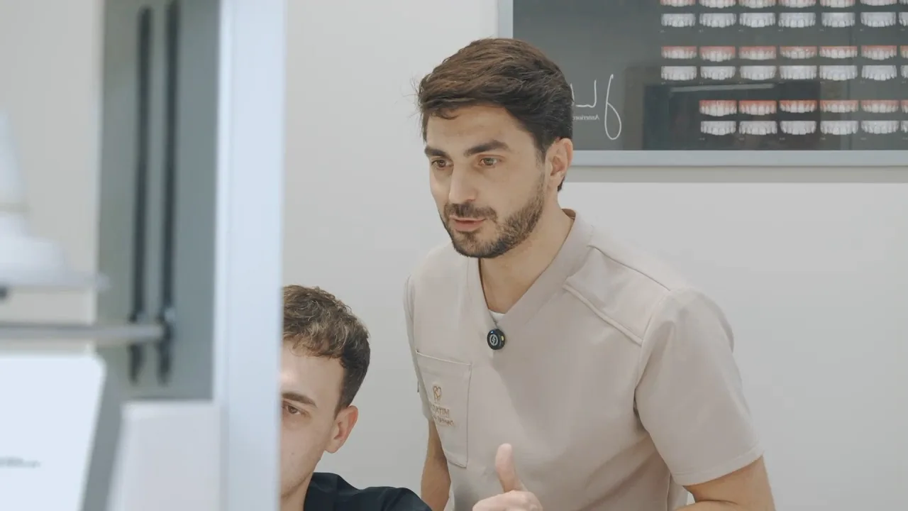 Dr Mitachi consulting with a patient at Mitachi Dental Studio